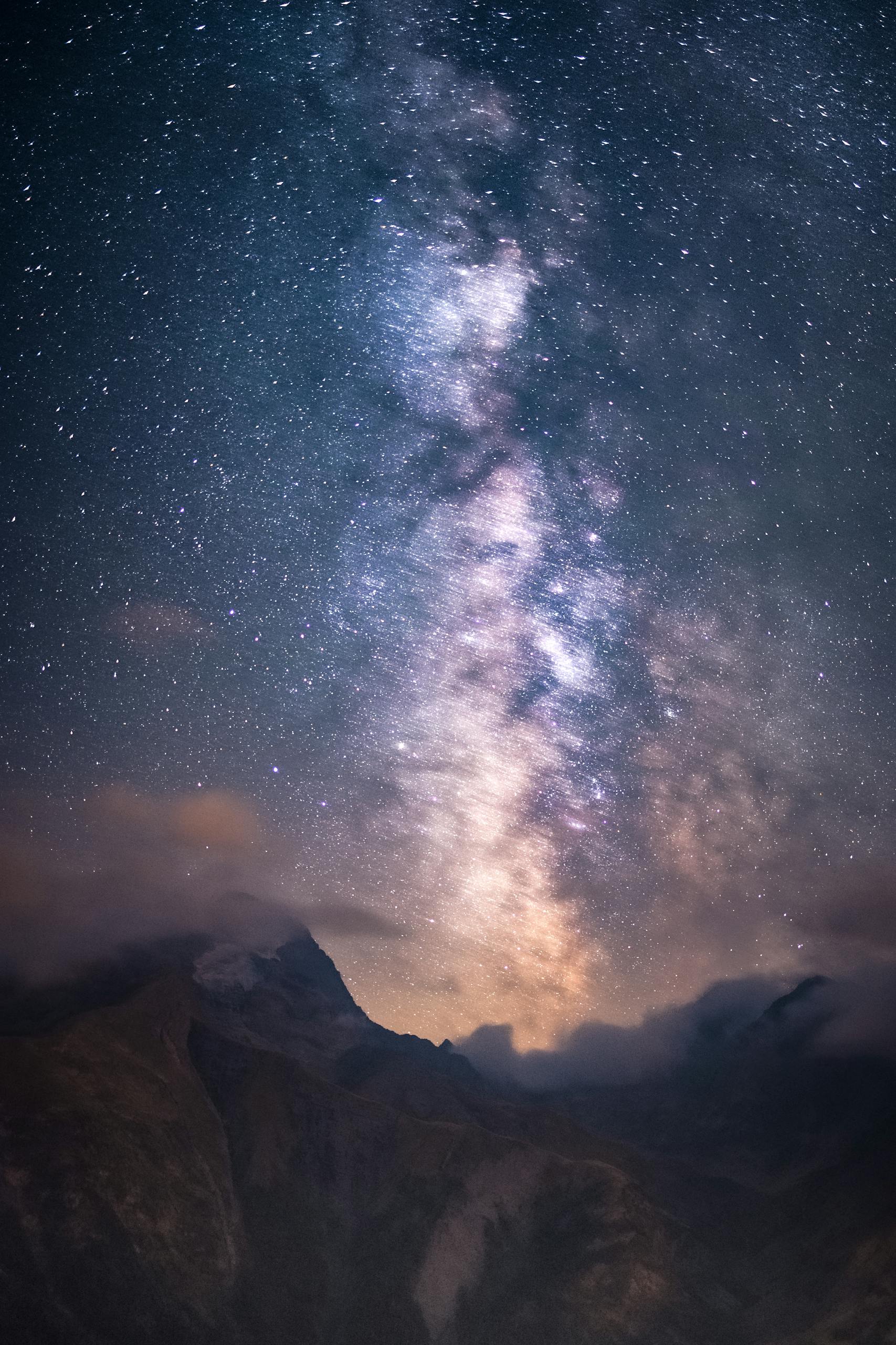 Breathtaking view of the Milky Way over alpine mountains, a perfect blend of nature and astronomy.